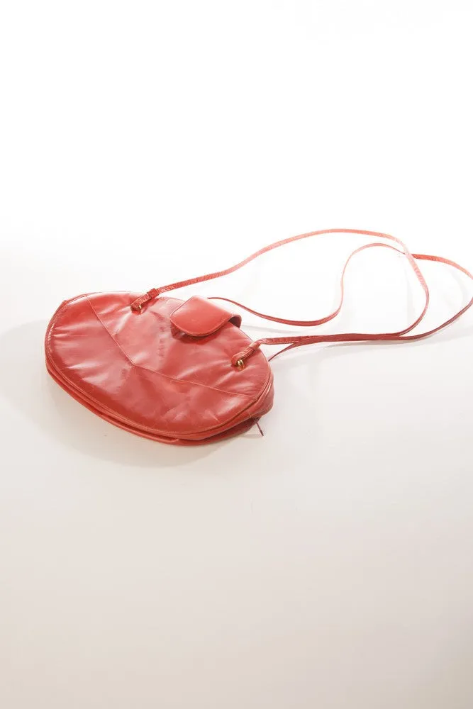 Allure's Scarlet Elegance: Gorgeous Oval-Shaped Red Leather Handbag