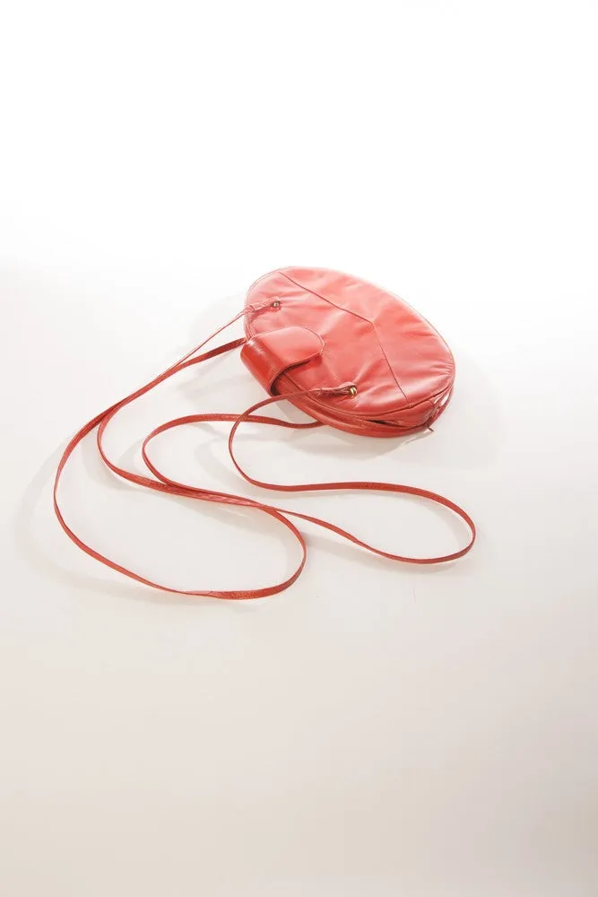 Allure's Scarlet Elegance: Gorgeous Oval-Shaped Red Leather Handbag
