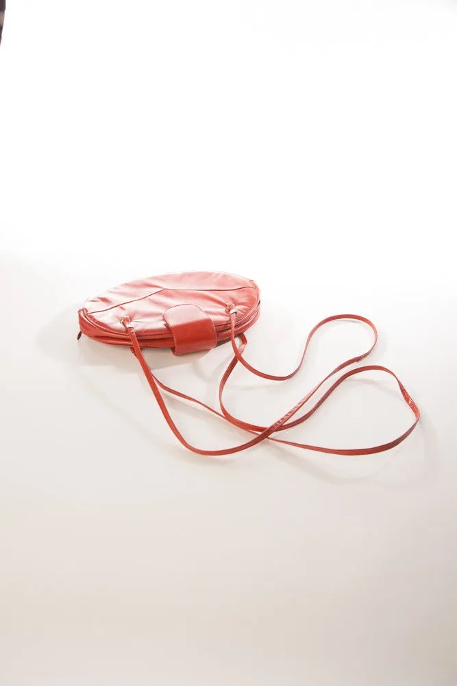 Allure's Scarlet Elegance: Gorgeous Oval-Shaped Red Leather Handbag