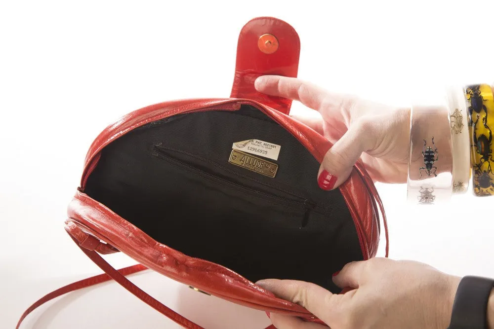 Allure's Scarlet Elegance: Gorgeous Oval-Shaped Red Leather Handbag